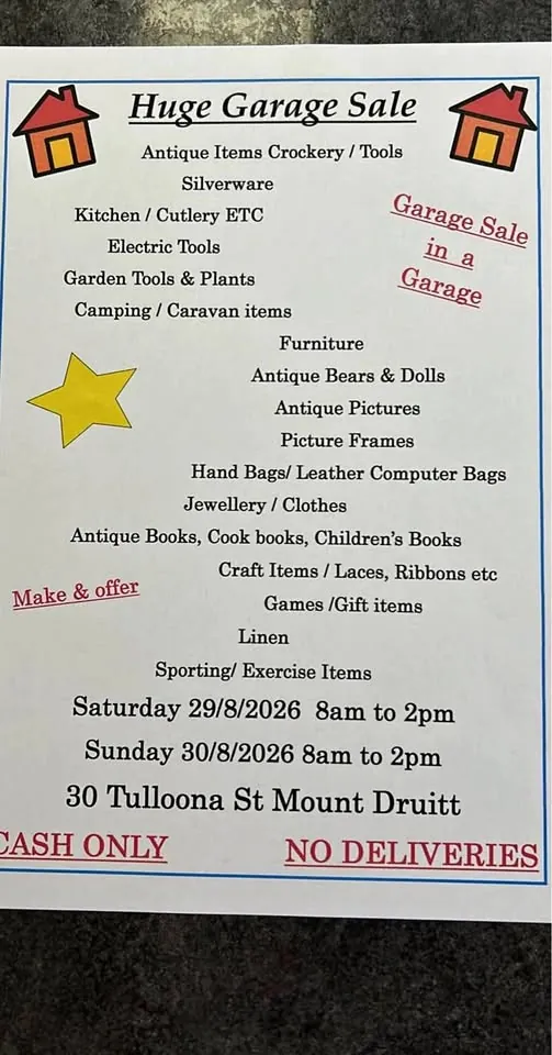 Garage sale in Mount Druitt NSW with antique dolls, tools, furniture and books