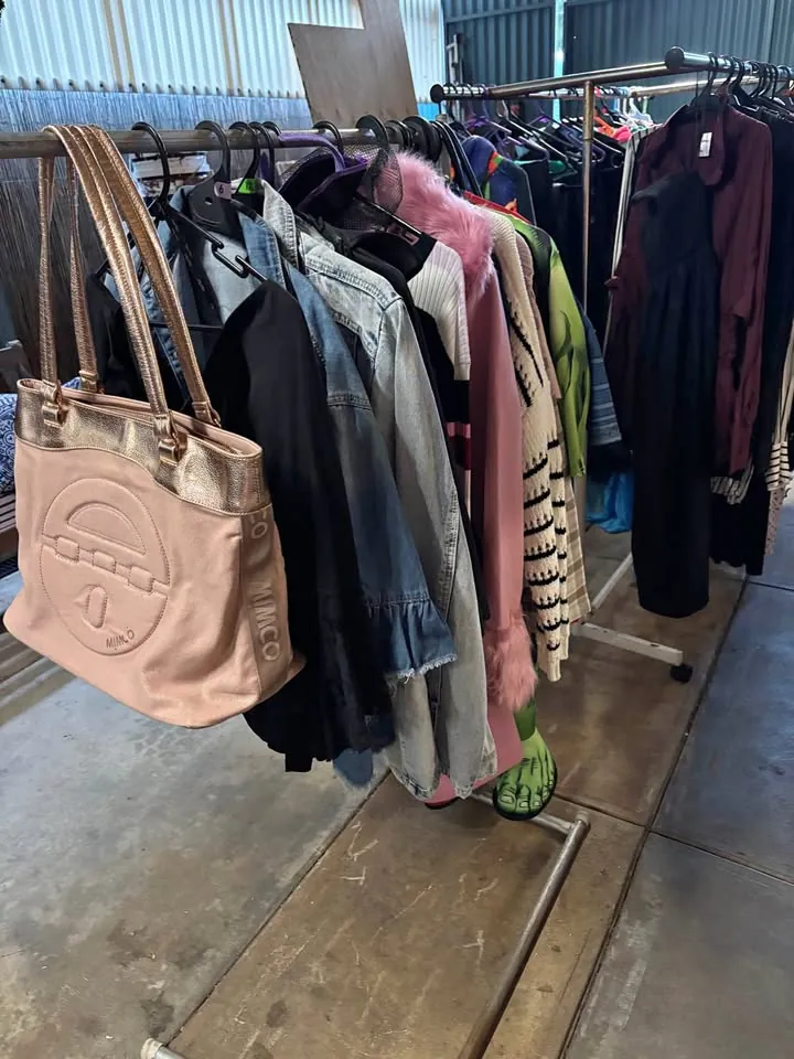 Garage sale in Salisbury Downs SA: clothing, bookshelf and household items