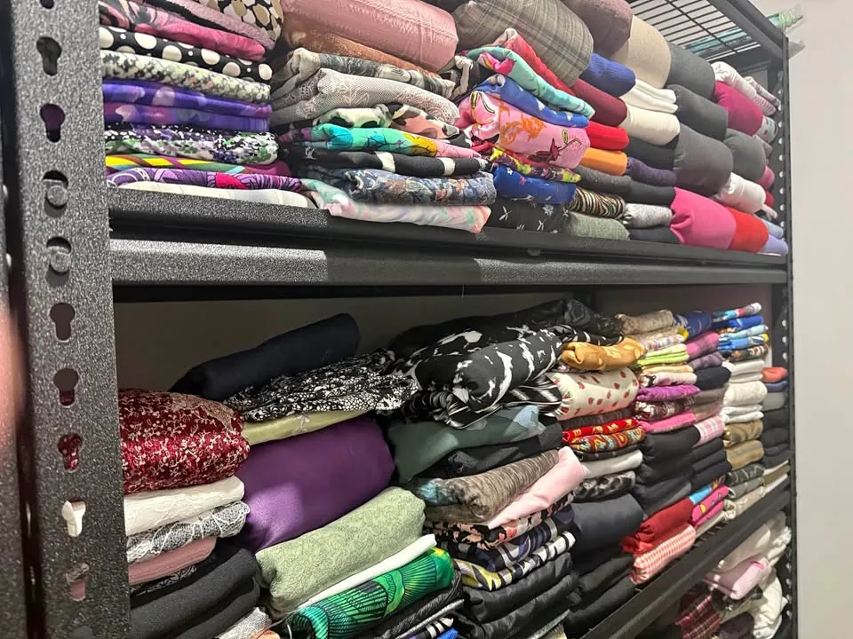 Garage sale in Carramar WA: rolls of fabric, buttons and handmade items