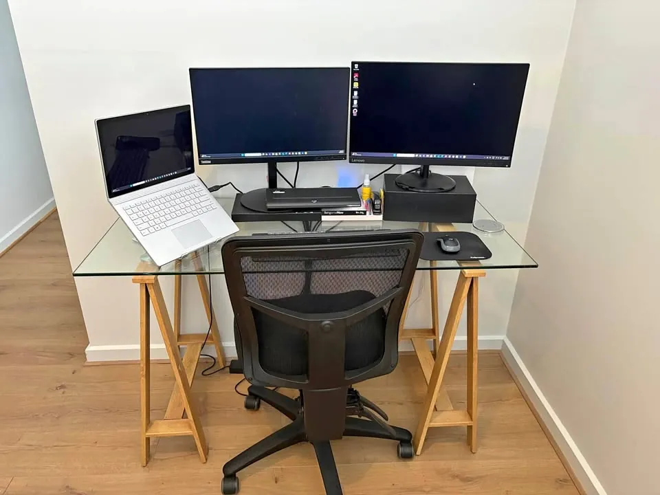 Moving sale in Adelaide SA: glass desk, swivel chair and Lenovo monitors