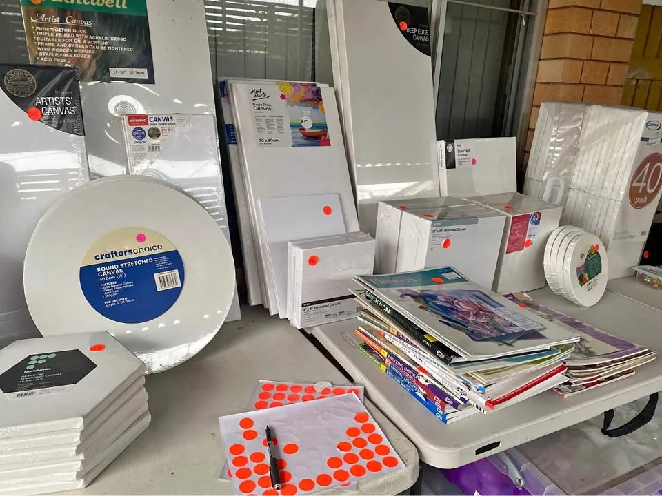 Garage sale in Lorn NSW with books, plants, pots and Christmas decorations