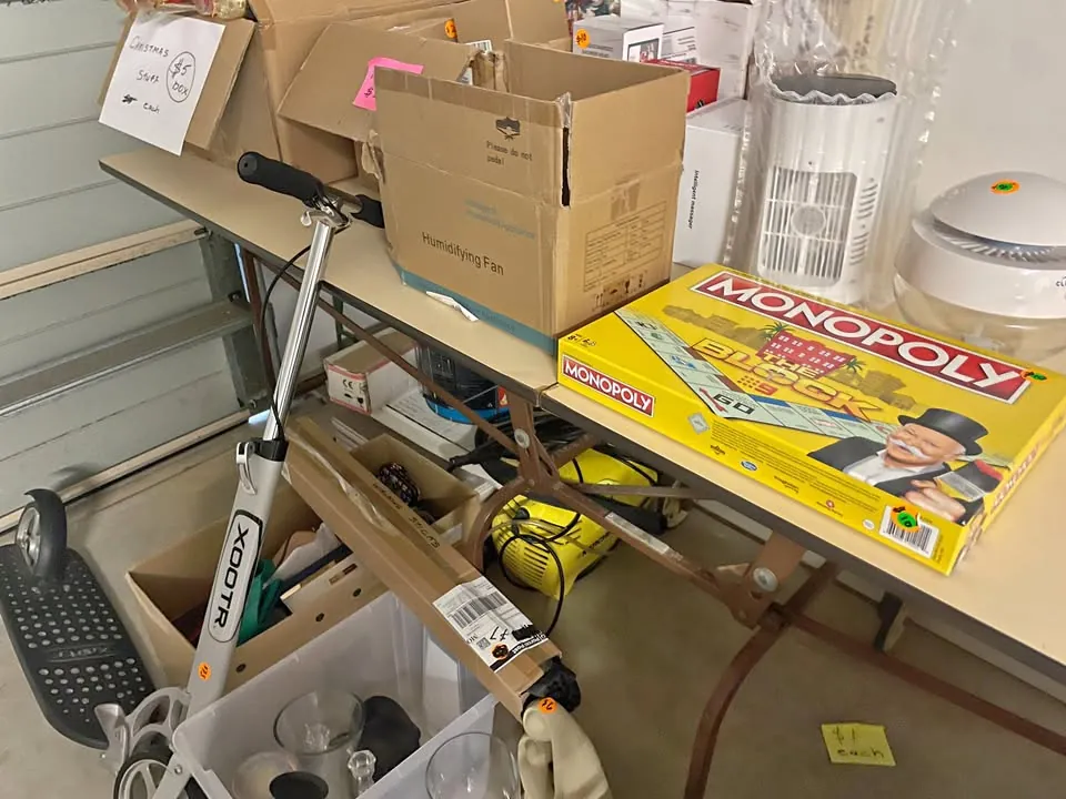 Garage sale in Wellington Point QLD: records, bookshelves, TV cabinet and sewing machine