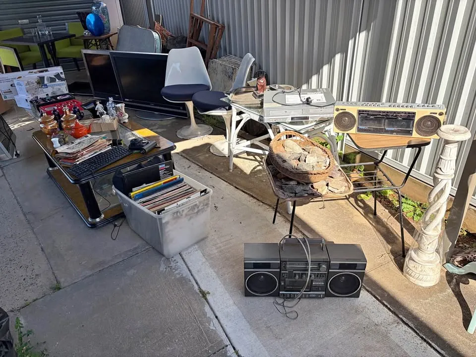 Garage sale in Merrylands NSW: velvet chaise lounge, vintage trunks and glassware